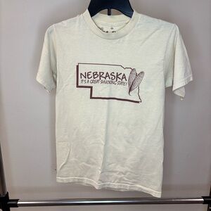 Nebraska Graphic Cream T-Shirt “ it’s a great shucking state” Mr.Chip’s Small